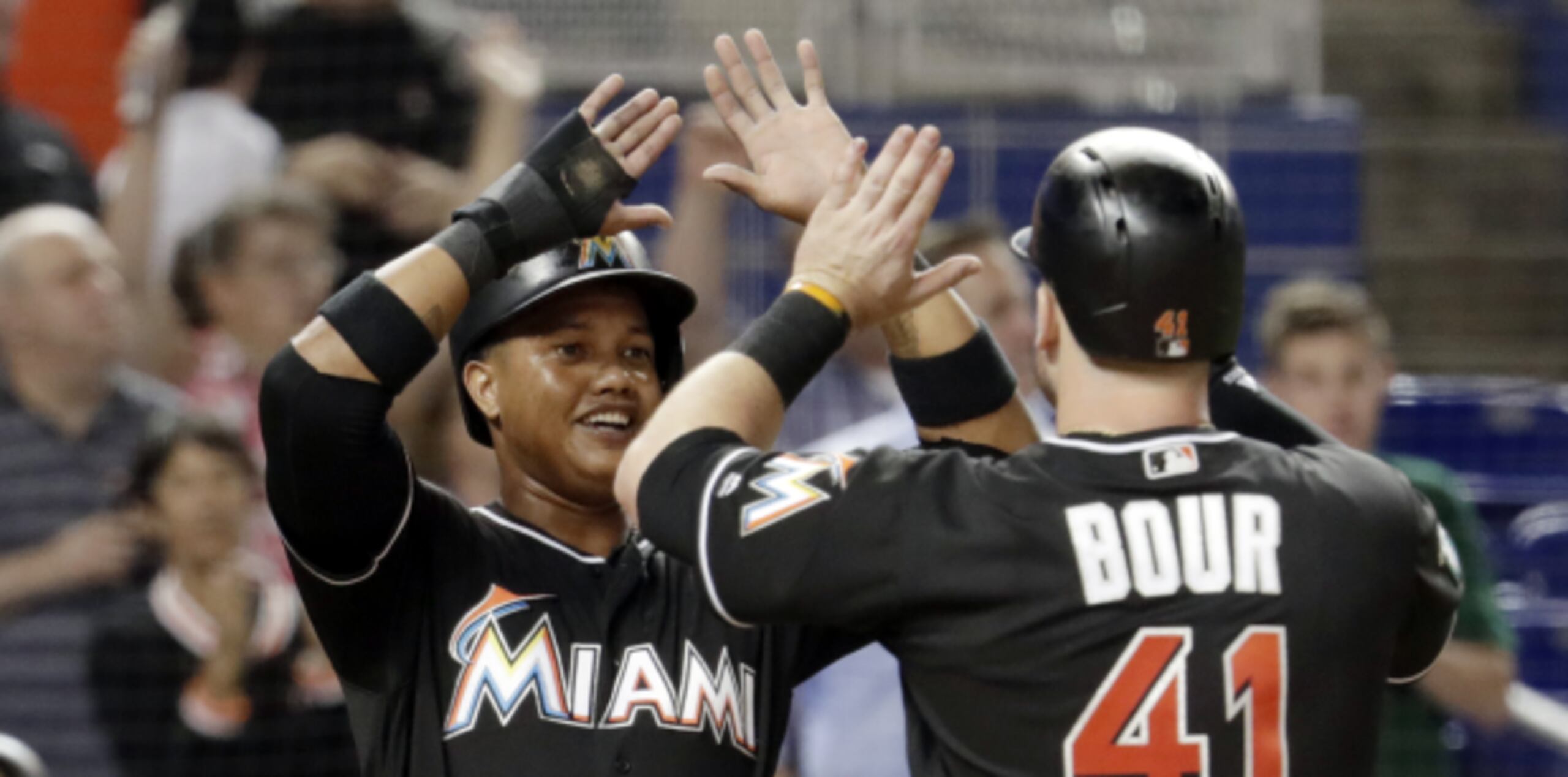 Starlin Castro y Justin Bour de los Miami Marlins. (AP / Lynne Sladky)