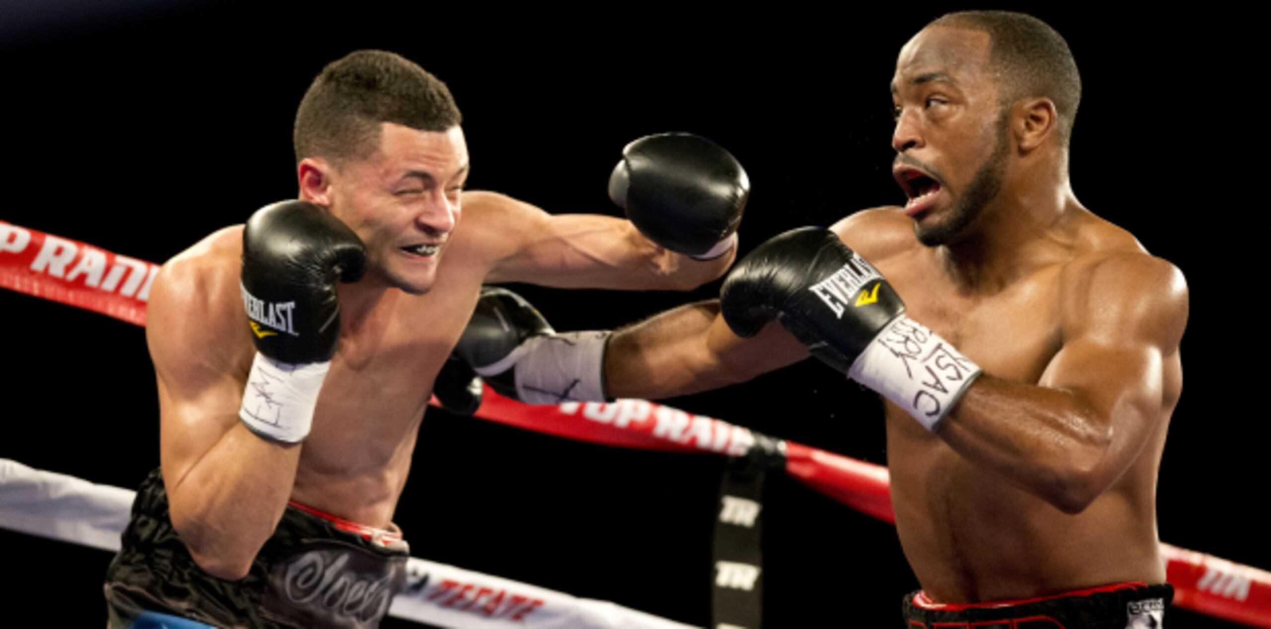 Luego de un parejo primer asalto, Luis González, izquierda, confrontó problemas con los potentes ganchos que colocó Michael Reed, quien al final de la pelea mantuvo su invicto profesional. (tonito.zayas@gfrmedia.com)