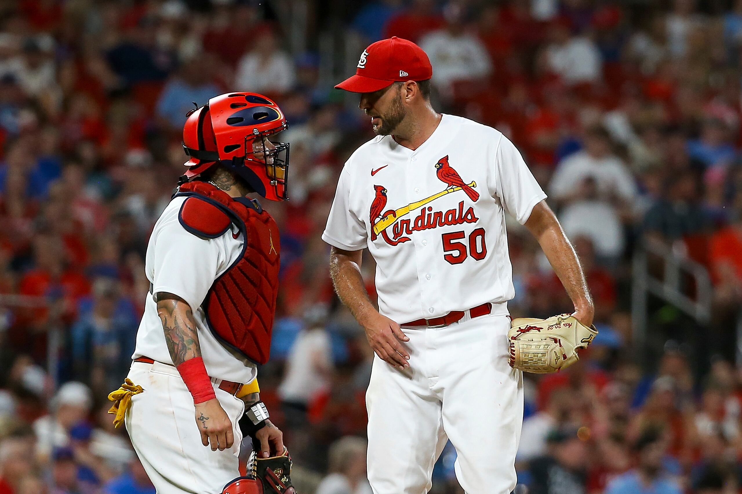 St. Louis Cardinals catcher Yadier Molina (4) talks with starting pitcher Adam Wainwright (50) during the seventh inning of a baseball game against the Chicago Cubs Tuesday, Aug. 2, 2022, in St. Louis. (AP Photo / Scott Kane)