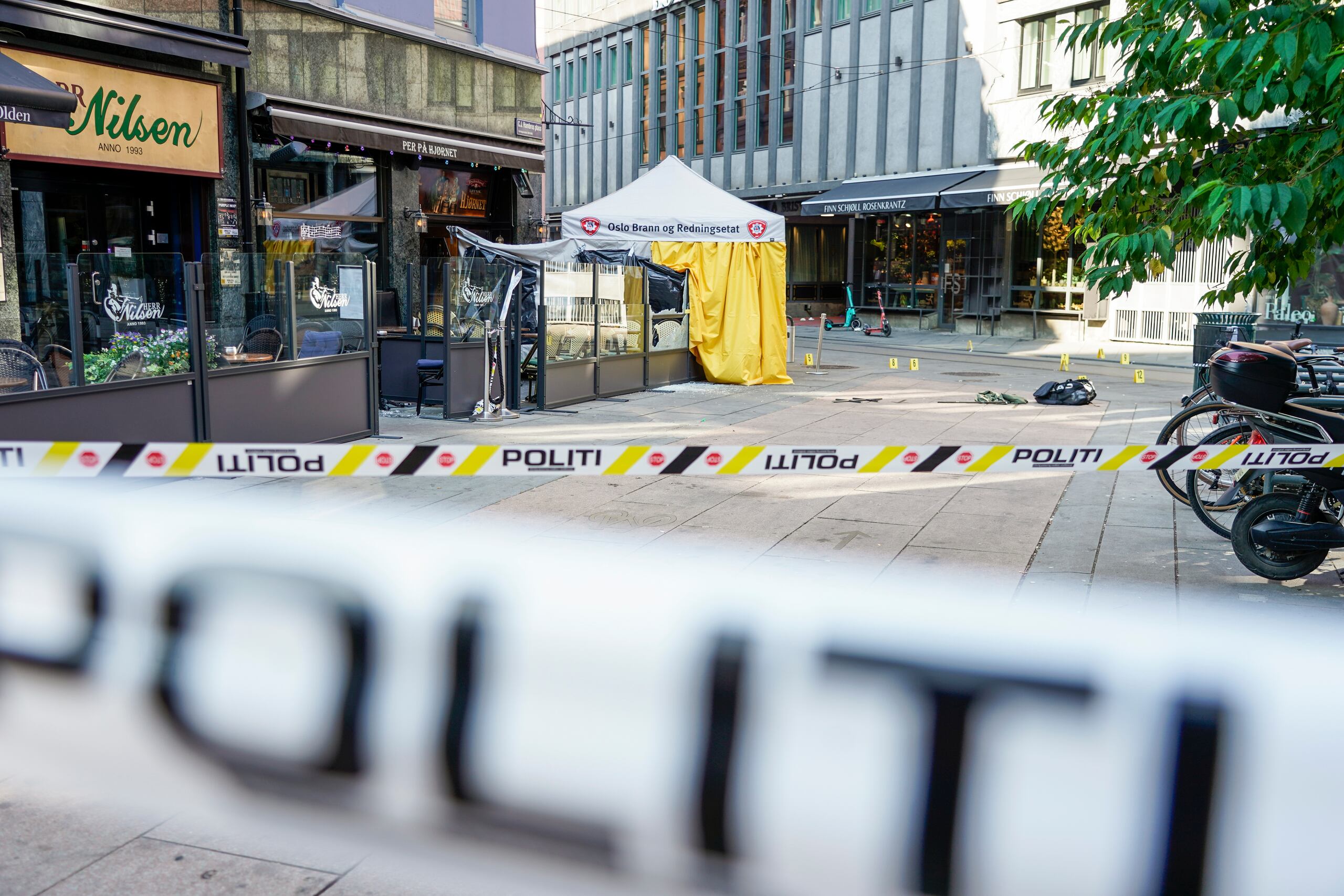 Police at the scene of a shooting in central Oslo, Saturday, June 25, 2022. Norwegian police say they are investigating an overnight shooting in Oslo that killed two people and injured more than a dozen as a case of possible terrorism. In a news conference Saturday, police officials said the man arrested after the shooting was a Norwegian citizen of Iranian origin who was previously known to police but not for major crimes. (Hakon Mosvold Larsen/NTB Scanpix via AP)