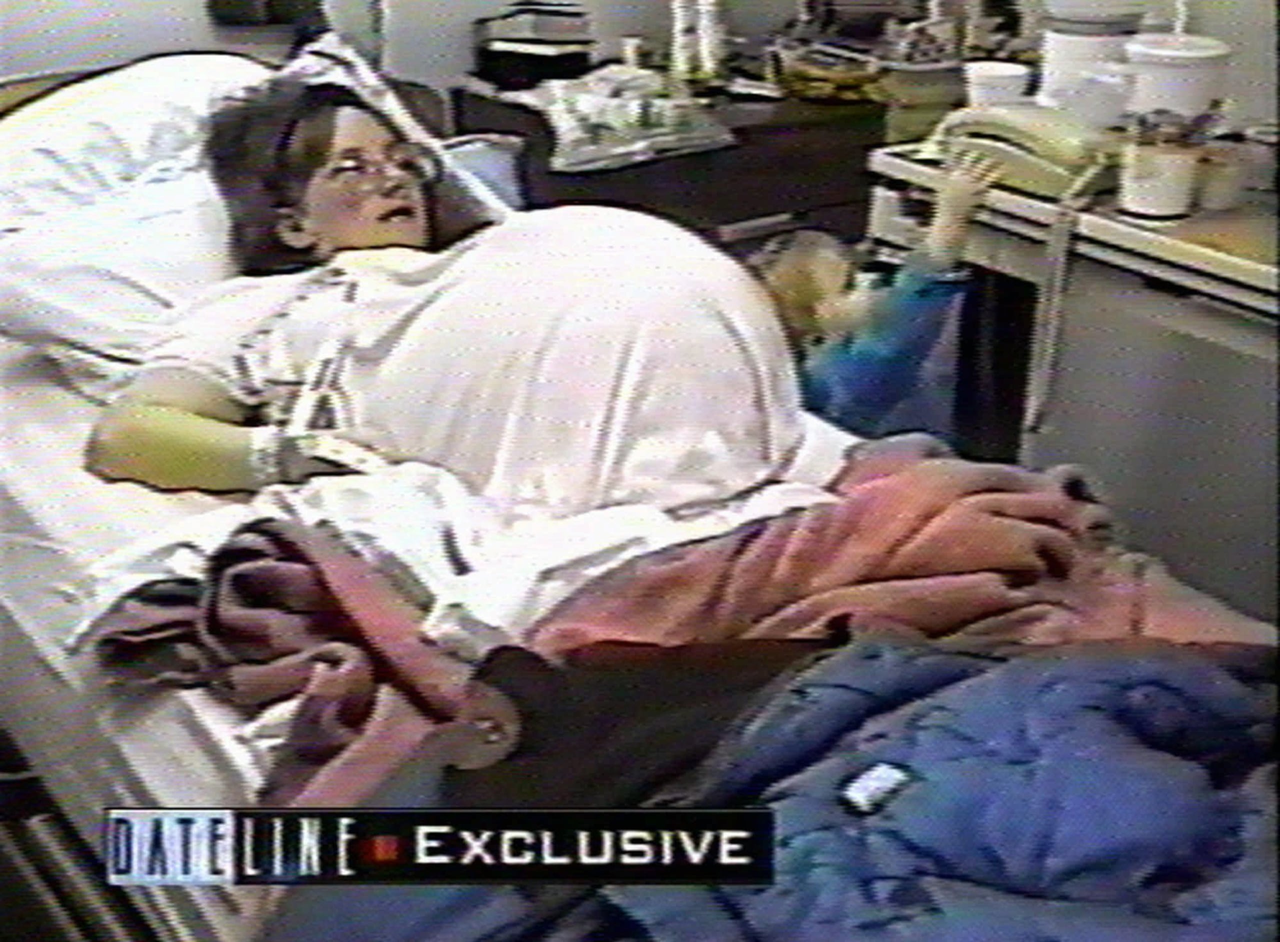 Bobbi McCaughey lies in her hospital bed at Iowa Methodist Hospital Center in Des Moines, Iowa, prior the birth of her septuplets, as seen in this undated image from television made available Tuesday, Nov. 25, 1997. The McCaughey's first child, Mikayla, is seen at right. (AP Photo/Dateline NBC) 