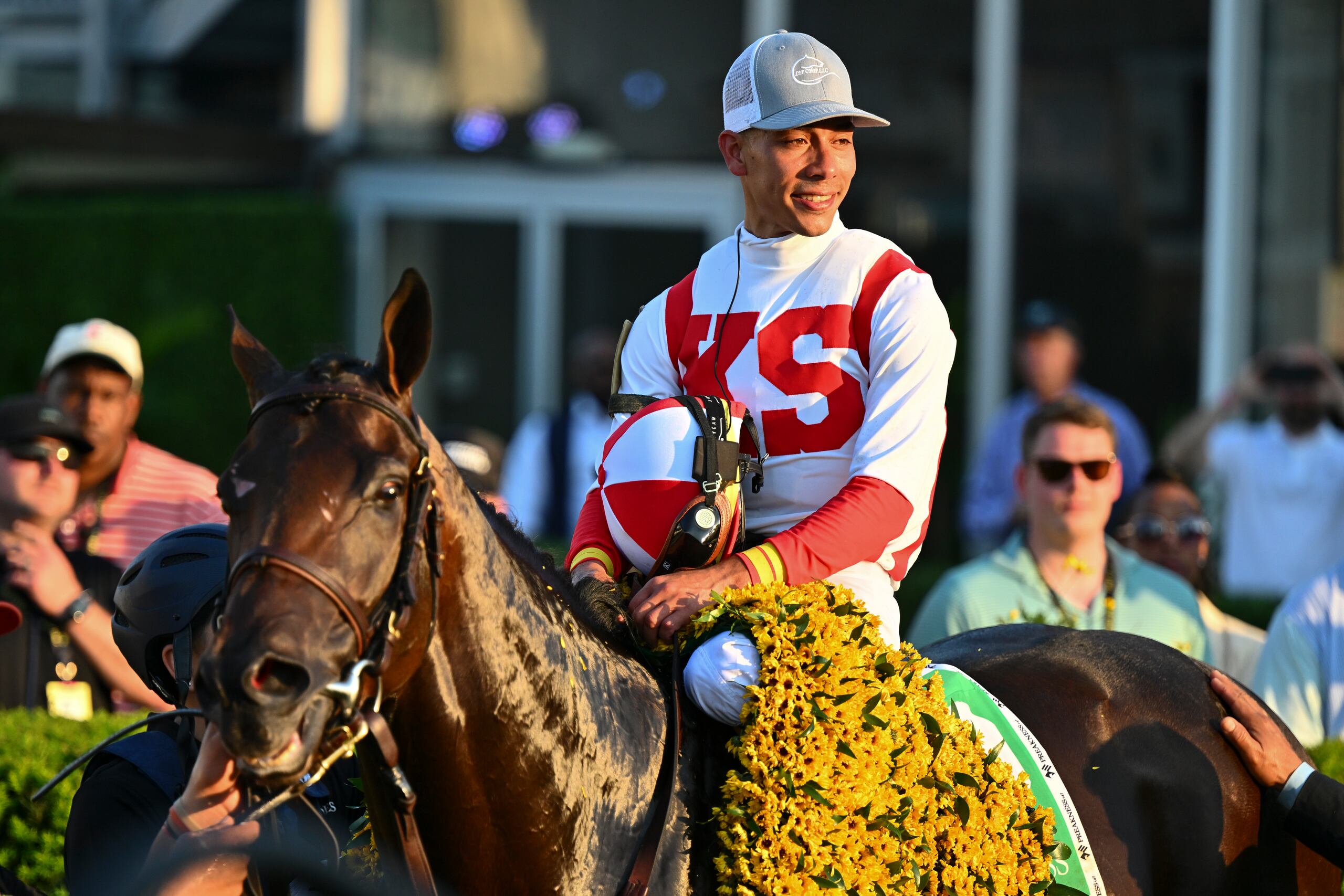 Jose Ortiz, atop Early Voting, parades in the winner's circle after winning the 147th running of the Preakness Stakes horse race at Pimlico Race Course, Saturday, May 21, 2022, in Baltimore. (AP Photo/Terrance Williams)