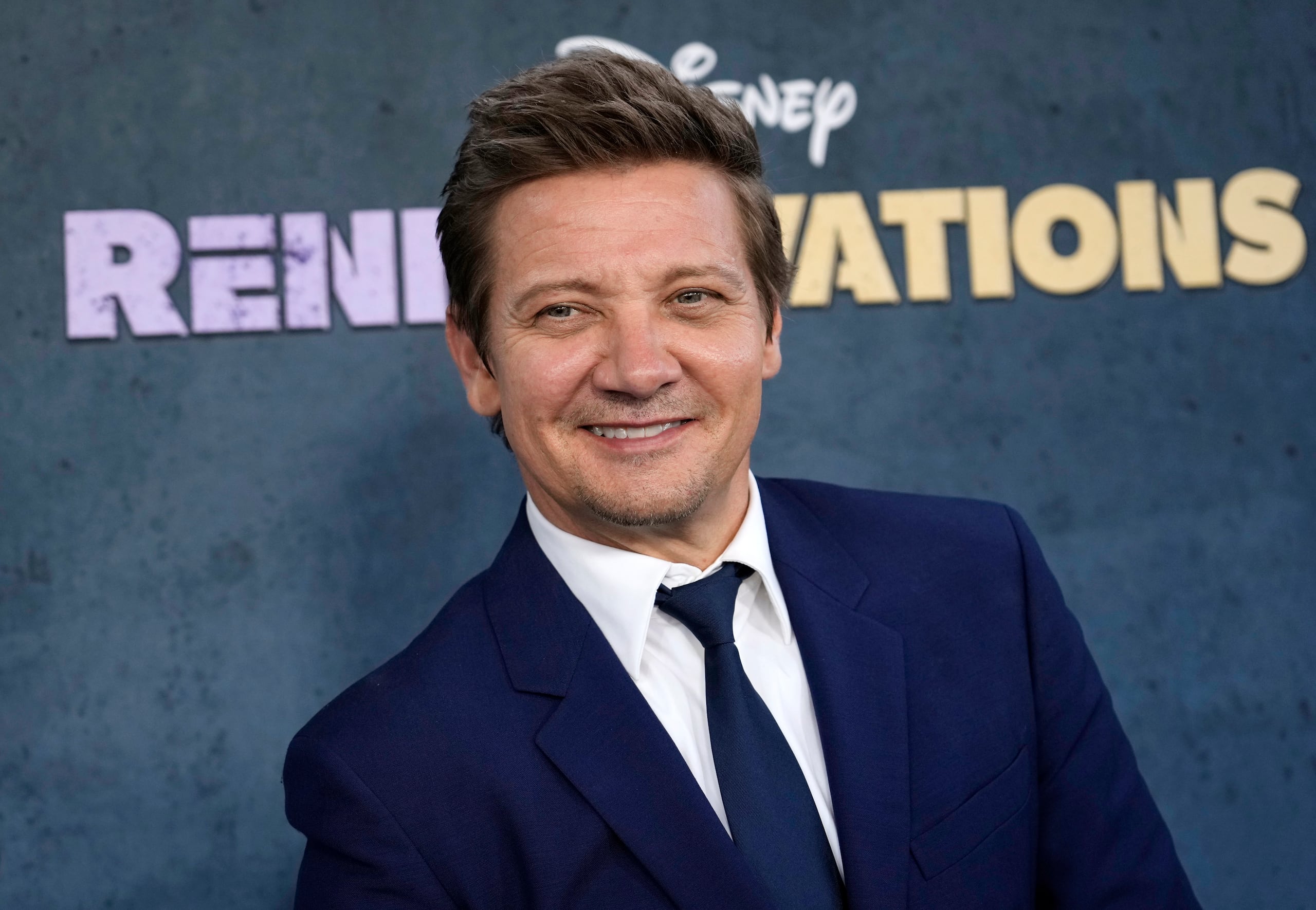 Jeremy Renner, the host and executive producer of "Rennervations," poses at the premiere of the four-part Disney+ docuseries, Tuesday, April 11, 2023, at the Westwood Regency Village Theatre in Los Angeles. The premiere marked Renner's first public, in-person appearance since a Jan. 1 snow plow accident outside his Reno, Nev., home left him with life-threatening injuries. (AP Photo/Chris Pizzello)